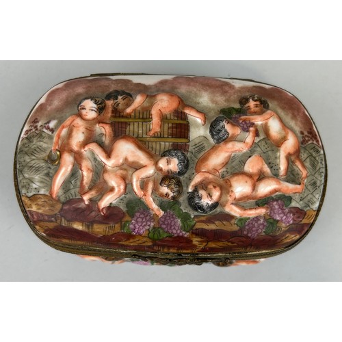 560 - A CAPODIMONTE BOX DECORATED WITH PUTTI, 

Marked to verso. 15cm x 10cm x 8cm