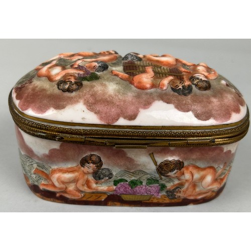 560 - A CAPODIMONTE BOX DECORATED WITH PUTTI, 

Marked to verso. 15cm x 10cm x 8cm