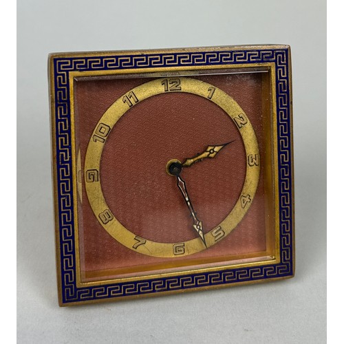 561 - AN ART DECO 1920'S TRAVEL CLOCK WITH GREEK KEY BORDER AND ENGINE TURNED MAUVE DIAL, 

In running ord... 