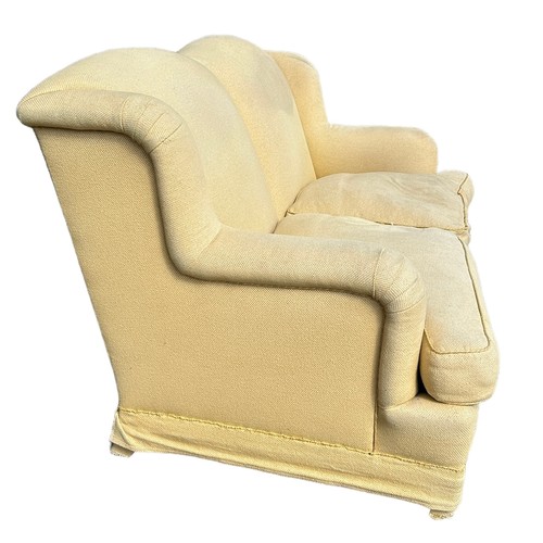 451 - A HOWARD STYLE HUMPBACK SOFA UPHOLSTERED IN YELLOW FABRIC, 

176cm x 105cm x 93cm