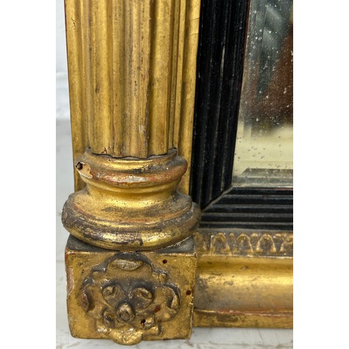 439 - A REGENCY GILT WOOD WALL MIRROR, 

73cm x 55cm

Corinthian columns, with carved oval patera.