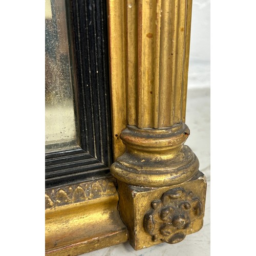 439 - A REGENCY GILT WOOD WALL MIRROR, 

73cm x 55cm

Corinthian columns, with carved oval patera.