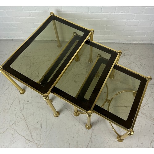 491C - A NEST OF THREE BRASS TABLES WITH GLASS INSERTS, 

Largest 58cm x 38cm x 45cm