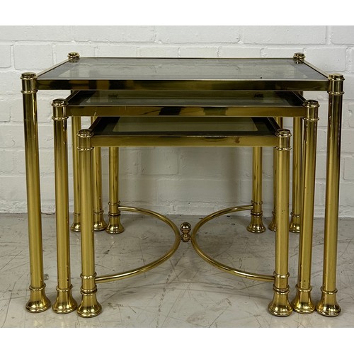 491C - A NEST OF THREE BRASS TABLES WITH GLASS INSERTS, 

Largest 58cm x 38cm x 45cm