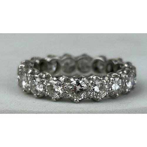 154 - AN 18CT WHITE GOLD AND DIAMOND ETERNITY RING CIRCA 1930'S,

17mm UK size N

4.5gms