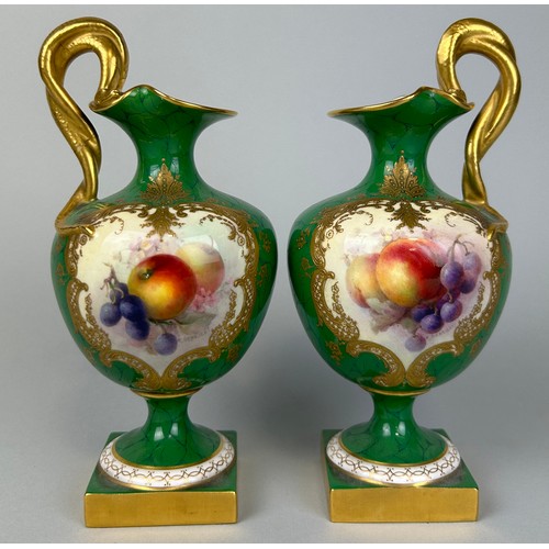 35 - A PAIR OF ROYAL WORCESTER GREEN PAINTED PEDESTAL VASES BY RICHARD SEBRIGHT WITH GILT SERPENT HANDLES... 