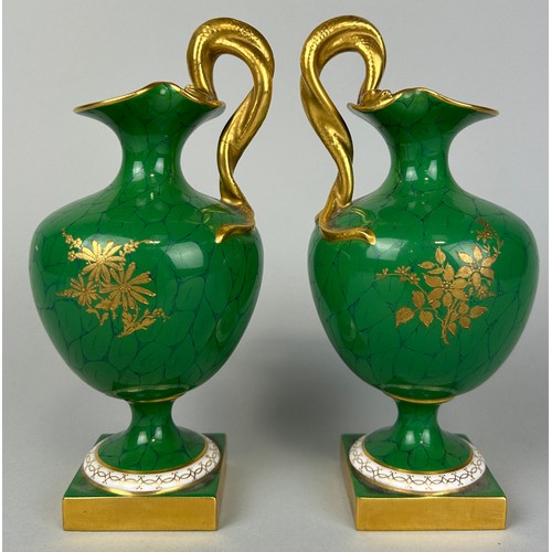 35 - A PAIR OF ROYAL WORCESTER GREEN PAINTED PEDESTAL VASES BY RICHARD SEBRIGHT WITH GILT SERPENT HANDLES... 