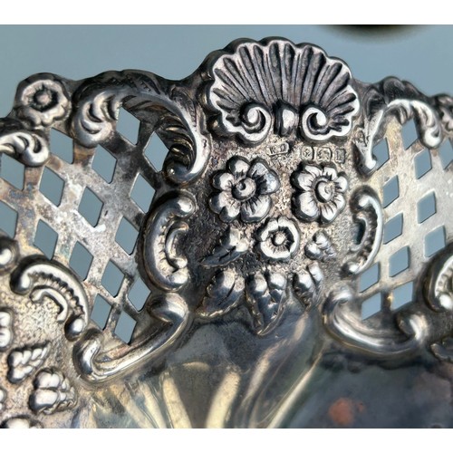 125 - A SILVER DISH MARKED FOR WILLIAM DEVENPORT, 

Pierced design with repousse flowers, on four legs. 

... 