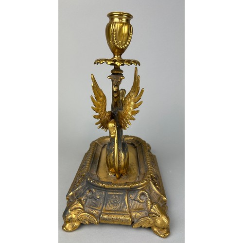 29 - A GILT METAL CANDLESTICK IN THE FORM OF A PHOENIX,

25cm x 22cm