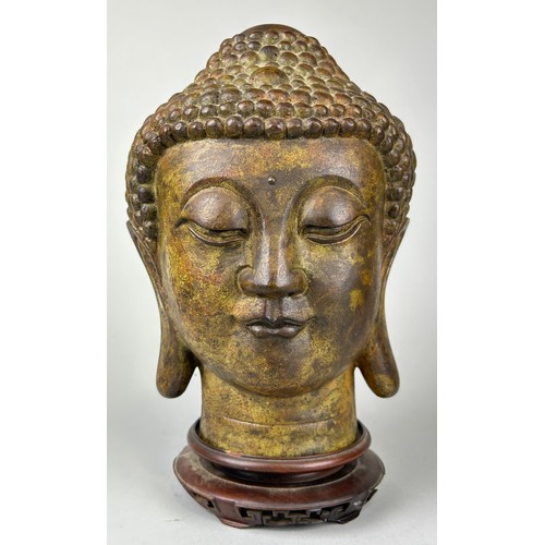 63 - A BRONZE HEAD OF BUDDHA, 

26cm H 

With rosewood stand.