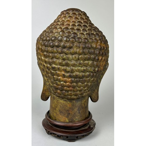 63 - A BRONZE HEAD OF BUDDHA, 

26cm H 

With rosewood stand.