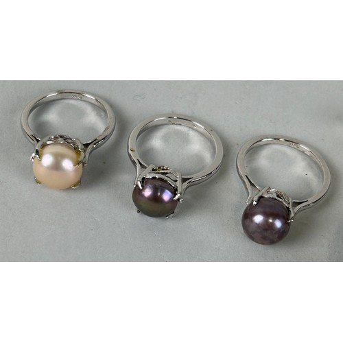 163 - A GROUP OF THREE PEARL AND SILVER RINGS ALONG WITH AN EMPORIO ARMANI STAINLESS STEEL LADIES WRISTWAT... 