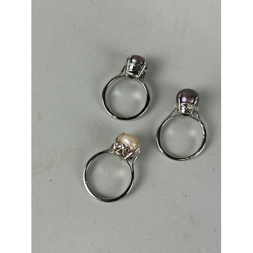 163 - A GROUP OF THREE PEARL AND SILVER RINGS ALONG WITH AN EMPORIO ARMANI STAINLESS STEEL LADIES WRISTWAT... 