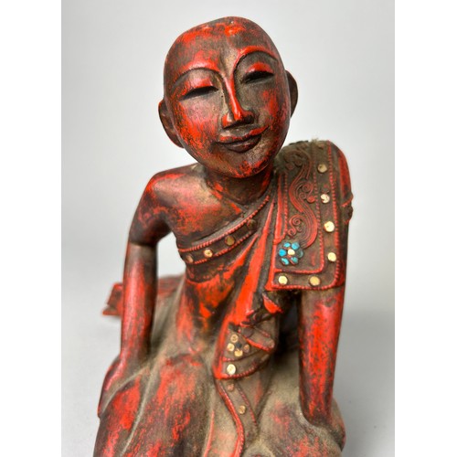 64 - A GROUP OF THREE CARVED WOODEN BUDDHA'S ALONG WITH A RED AND BLACK LACQUERED TRAY, 

Largest Buddha ... 