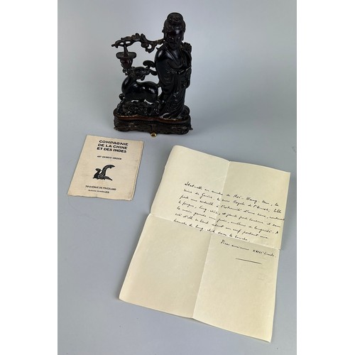 59 - A CHINESE AMBER STATUE DEPICTING HSI WANG MU, 

Accompanied by a letter, written in French along wit... 