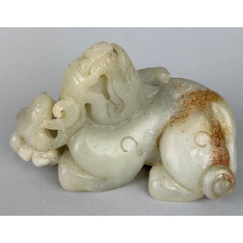 246 - A CHINESE JADE FIGURE OF A LION IN THE ARCHAIC STYLE,

17cm x 10cm