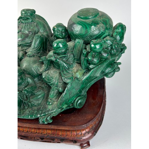 244 - A CHINESE MALACHITE SCULPTURE DEPICTING A BUDDHA WITH FIGURES PLAYING MUSICAL INSTRUMENTS, 

30cm x ... 