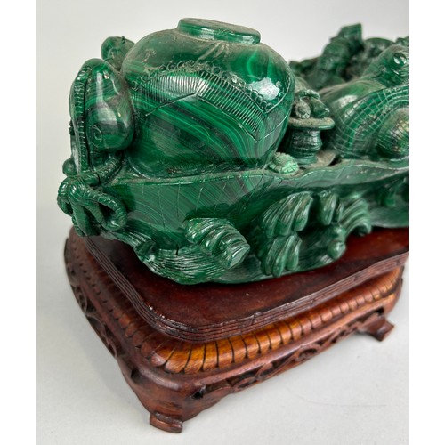 244 - A CHINESE MALACHITE SCULPTURE DEPICTING A BUDDHA WITH FIGURES PLAYING MUSICAL INSTRUMENTS, 

30cm x ... 