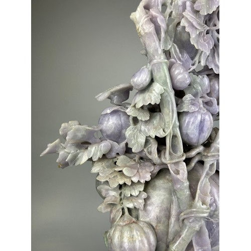 245 - A VERY LARGE AND HEAVY CHINESE JADE SCULPTURE DEPICTING FRUITS, BIRDS AN FOLIAGE, 

67cm H x 43cm W