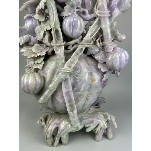 245 - A VERY LARGE AND HEAVY CHINESE JADE SCULPTURE DEPICTING FRUITS, BIRDS AN FOLIAGE, 

67cm H x 43cm W