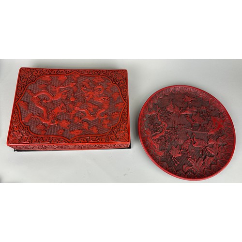 254 - A CHINESE RED LACQUERED CINNABAR BOX ALONG WITH A SIMILAR CIRCULAR PLATE (2), 

Box 39cm x 29cm 

Pl... 