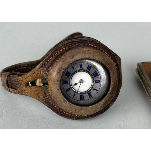 134 - A SILVER POCKET WATCH IN BROWN LEATHER STRAP, A CARRIER DIVISION ONE LIGHTER, AND AN ANTIQUE PIPE (4... 