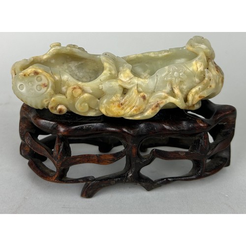 76 - A CHINESE JADE MOUNTED ON ROSEWOOD STAND, 

Jade measures 12cm x 5cm