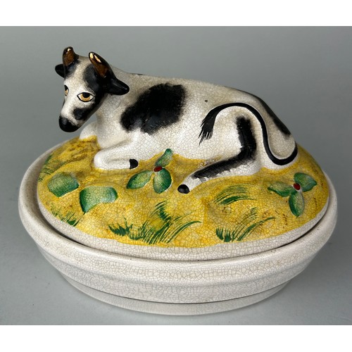 256 - A CERAMIC 'COW' DISH AND LID,
 
17cm x 13cm