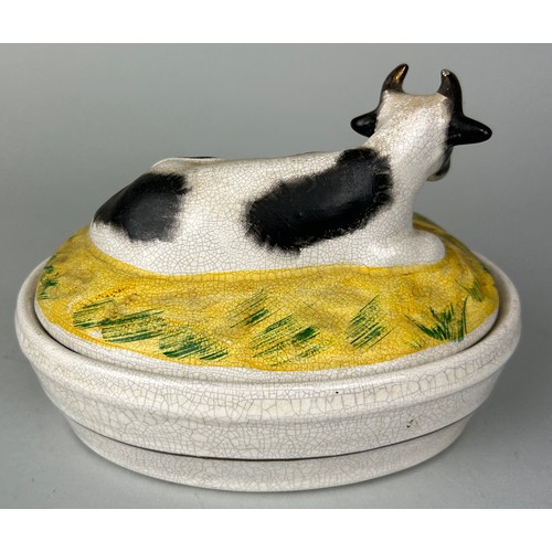 256 - A CERAMIC 'COW' DISH AND LID,
 
17cm x 13cm