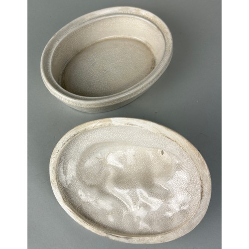 256 - A CERAMIC 'COW' DISH AND LID,
 
17cm x 13cm