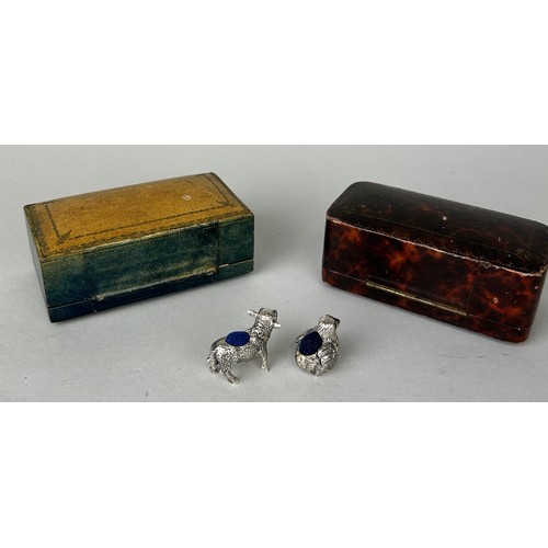 150 - TWO SILVER PIN CUSHIONS WITH TWO UNRELATED ANTIQUE BOXES,

Cushions weight: 26gms