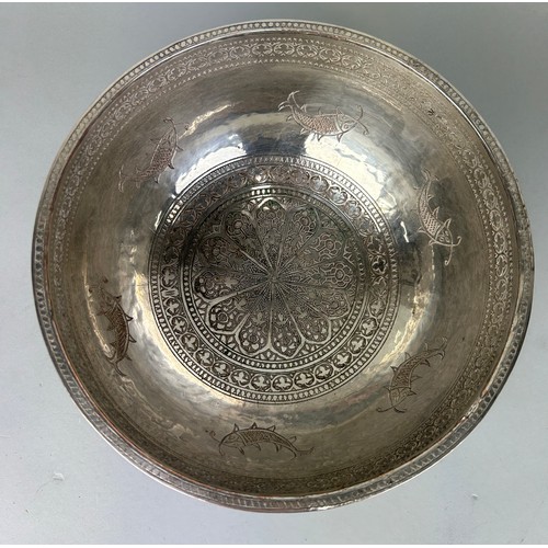 121 - A PERSIAN SILVERED COPPER BOWL CHASED WITH FISH MOTIF, 

20cm x 10cm 

Possibly 19th Century.