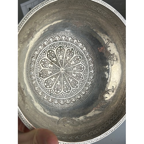 121 - A PERSIAN SILVERED COPPER BOWL CHASED WITH FISH MOTIF, 

20cm x 10cm 

Possibly 19th Century.