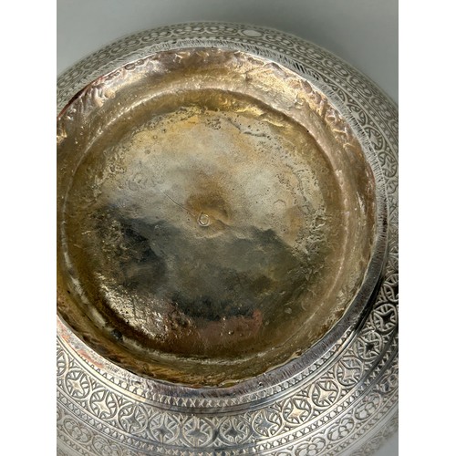 121 - A PERSIAN SILVERED COPPER BOWL CHASED WITH FISH MOTIF, 

20cm x 10cm 

Possibly 19th Century.