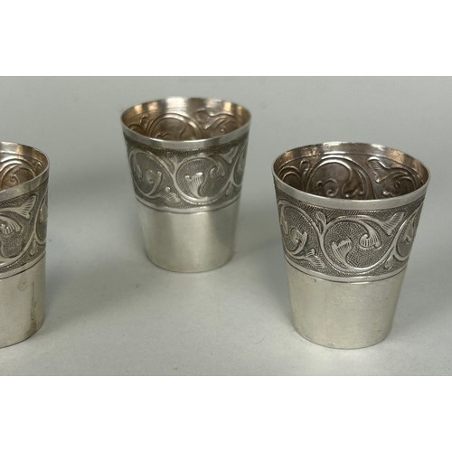 124 - A SET OF TWELVE PERSIAN SILVER SILVER SHOT CUPS, 

4cm H each. 

Weight: 169gms