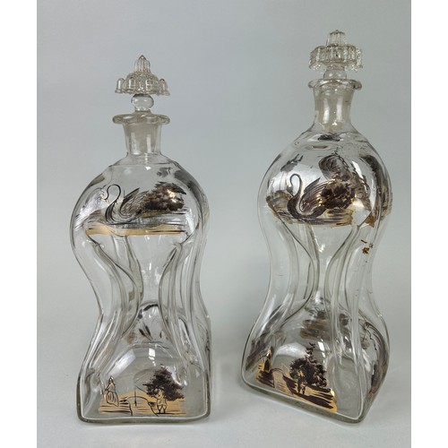 202 - A PAIR OF DUTCH ANTIQUE GLASS DECANTERS OF UNUSUAL FORM, 

Painted with depictions of rural life. 

... 