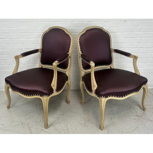 477 - A PAIR OF FRENCH LOUIS XVI STYLE FAUTEUILS, 

Upholstered in purple fabric 

95cm x 65cm x 55cm each... 