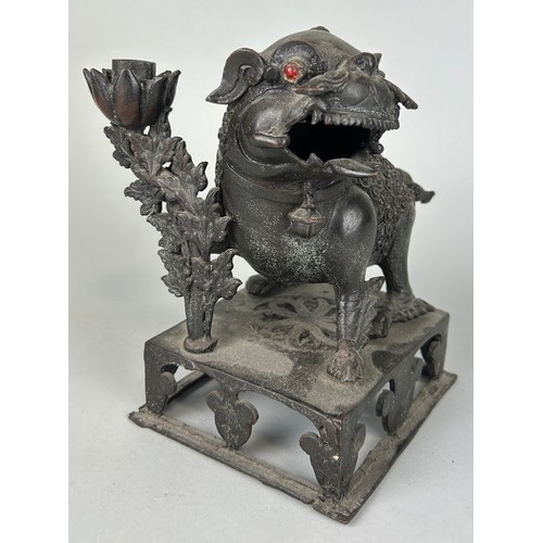 82 - A CHINESE BRONZE FIGURE OF A TEMPLE LION, 

20cm x 17cm