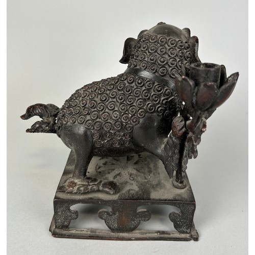 82 - A CHINESE BRONZE FIGURE OF A TEMPLE LION, 

20cm x 17cm