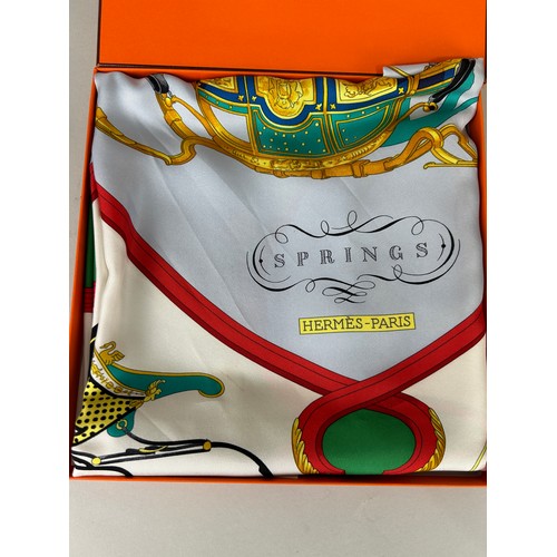 230 - AN HERMES SILK SCARF 'SPRINGS', 

In original box, with Hermes bag. 

88cm D