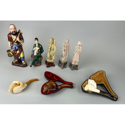 73 - A GROUP OF FIVE CHINESE FIGURES AND THREE AMBER PIPES (8)