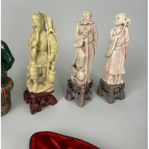 73 - A GROUP OF FIVE CHINESE FIGURES AND THREE AMBER PIPES (8)