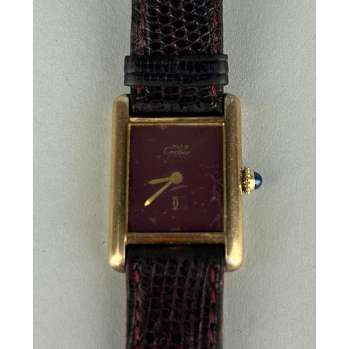 159 - A LADIES MUST DE CARTIER WRISTWATCH, 

Vermeil gold plated silver, mechanical movement and brown lea... 