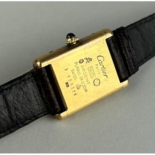 159 - A LADIES MUST DE CARTIER WRISTWATCH, 

Vermeil gold plated silver, mechanical movement and brown lea... 