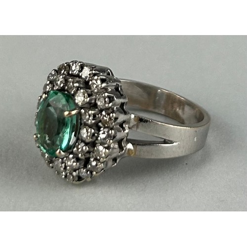 167 - A LADIES 18CT WHITE GOLD RING SET WITH AN EMERALD SURROUNDED BY DIAMONDS, 

Weight: 6.2gms