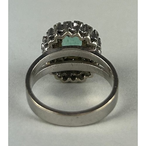 167 - A LADIES 18CT WHITE GOLD RING SET WITH AN EMERALD SURROUNDED BY DIAMONDS, 

Weight: 6.2gms