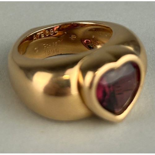 166 - A PIAGET 18CT GOLD RING SET WITH A CENTRAL RED STONE, 

Weight: 19.1gms