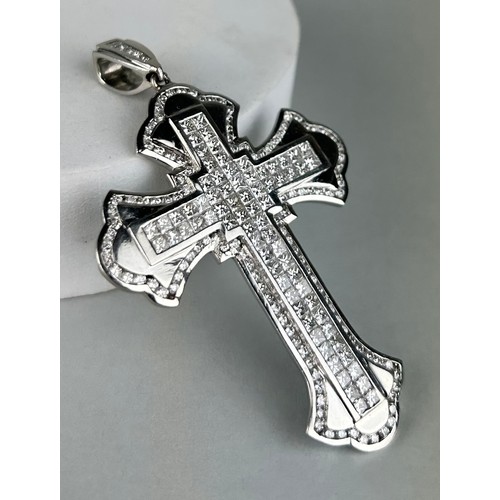 179 - A GENTLEMAN'S PLATINUM CROSS SET WITH DIAMONDS, 

Weight: 42.5gms 

8cm x 5cm