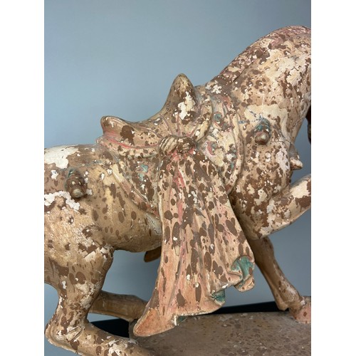 1 - A CHINESE TANG STYLE TERRACOTTA HORSE WITH TRACES OF PIGMENT, 

48cm x 38cm x 14cm

Sitting on a woo... 