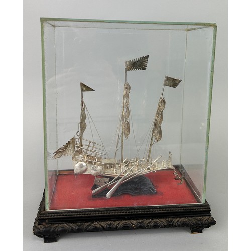 141 - A CHINESE SILVER JUNK SHIP IN PERSPEX CASE, 

21cm x 17cm